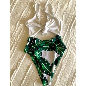 High waisted/high cut palm one piece.